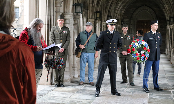 Group of military personnel and veterans at Cornell Veterans Memorials tour